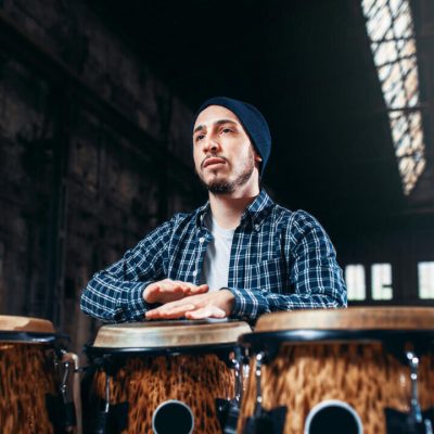male-drummer-plays-on-wooden-drum-2021-08-26-16-26-01-utc-e1697779026137.jpg